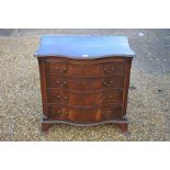 A mahogany serpentine front chest of drawers