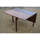 A 19th century mahogany drop leaf dining table