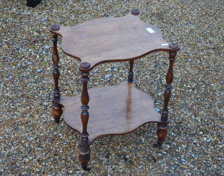 A Victorian rosewood and mahogany two-tier table