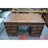 A Victorian oak twin pedestal desk