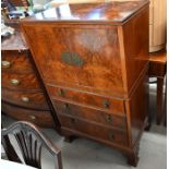 A mid-century walnut cabinet