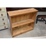 A modern pine open bookcase