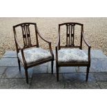 A pair of Edwardian mahogany carver chairs