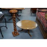 A mahogany oval coffee table to/w a hardwood jardiniere stand (2)