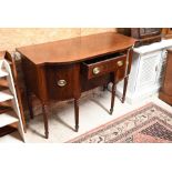 An Edwardian mahogany and ebony-inlaid bow front sideboard