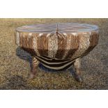 A circular zebra skin drum table