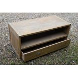 A modern oak and chromed metal mounted low cabinet