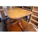 A Regency style mahogany extending dining table