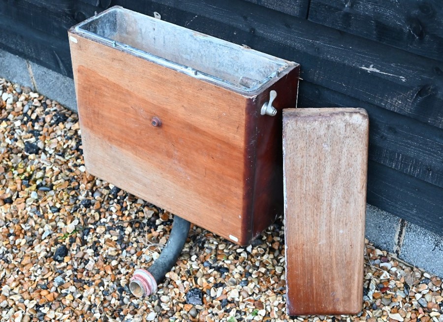An old mahogany lead lined cistern