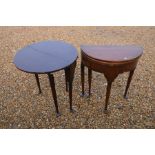 A matched pair of 19th century mahogany demi lune tea tables