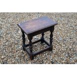 An early 20th century oak joint stool