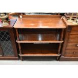 An early 20th century oak three-tier buffet