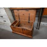 A small antique stained pine trunk