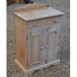 A stripped pine bedroom cabinet
