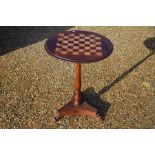 A late Victorian rosewood inlaid chess table