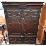 A 19th century Jacobean style jointed oak press cupboard