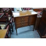 An Edwardian satin walnut music cabinet