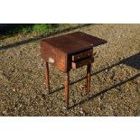 A 19th century mahogany drop leaf table