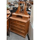 A modern pine mirror-backed dressing chest