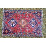 A Caucasian red ground rug