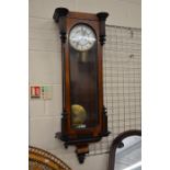 A walnut cased Vienna style wall clock