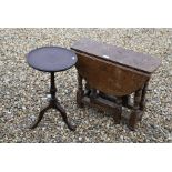 An antique small oak drop leaf table