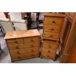 A modern pine chest of two short over three long drawers to/w a pair of matching bedside chests