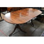 A reproduction Regency style mahogany dining table