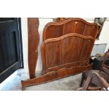 A French chestnut panelled double bed frame