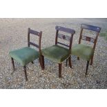 A set of four 19th century mahogany inlaid dining chairs