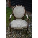 A Louis XV style carved walnut salon armchair