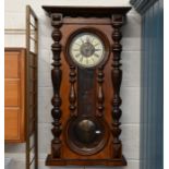 A walnut cased Vienna style wall clock