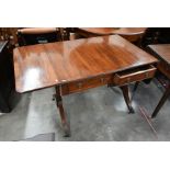 A Regency style mahogany and ebony strung sofa table