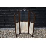 An Edwardian mahogany folding screen