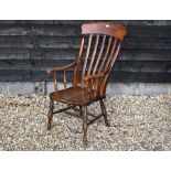 An oak and elm seated Windsor style armchair