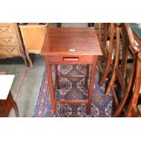 A stained oak square lamp table with single drawer