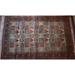 A Persian Qum carpet, 335 cm x 21 cm