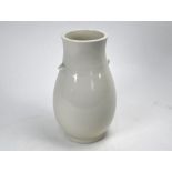 A 20th century Japanese white monochrome glazed vase, 25 cm high