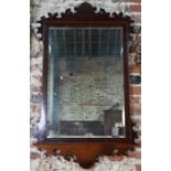 A George III mahogany fret framed mirror