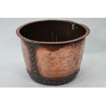 A large rivetted stud copper tub