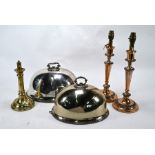 Two meat domes and three candlesticks