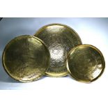 Two Persian brass trays and an Egyptian example