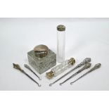 Silver-topped inkwell, toothbrush jar, scent flask and button hooks