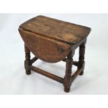 A small antique oak gateleg drop leaf coffee table