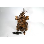 An antique Black Forest pitch pine cuckoo clock