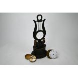 A 19th century French Empire style brown patinated brass lyre clock