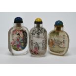 Three Chinese inside-painted snuff bottles painted with landscapes and figures