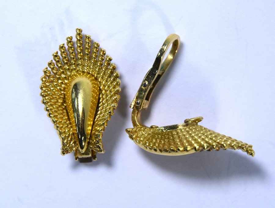 A pair of 18ct yellow gold earrings in the form of a stylised leaf