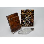 Two card cases and a cut glass flask and stopper