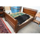 A flame mahogany double sleigh bed